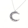 Silver crescent moon necklace on a silver chain