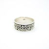 Celtic knot solid band ring on a white background