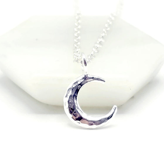 Silver necklace with a crescent moon pendant