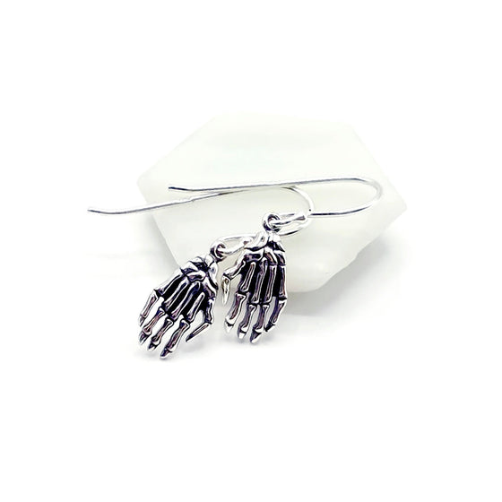 Pair of skeleton hand earrings