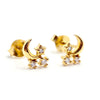 Gold earrings with moon and star designs on a white background