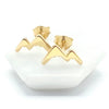 Gold mountain-like design stud earrings on a white background