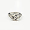 Silver signet ring with a sun with face engraved on white background