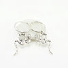Silver earrings with snake designs on a white background
