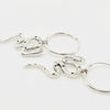 Hoop earrings with snakes attachments flat on a white background
