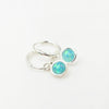 Silver hoop earrings with round lab opal charm
