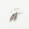 Silver feather-shaped Charm on 925 Silver hoops