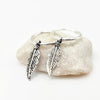 Silver feather-shaped Charm on 925 Silver hoops