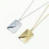 Envelope pendant with letter inside. Made of stainless steel availile in Gold and Silver. Part of the engravable collection