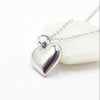 A polished silver heart-shaped pendant necklace made with stainless steel, Part of the engravable range