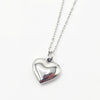 A silver heart-shaped pendant necklace on a delicate silver chain,t of our engravable collection. Made in stainless steel