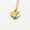 A gold heart-shaped pendant necklace on a delicate gold chain,Made with stainless steel