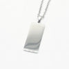 A silver rectangular pendant necklace with a polished, reflective finish on a delicate silver chain, Part of our engravable range