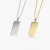 Two rectangular pendant necklaces on white chains, one silver-toned and one gold-toned,made with stsinless steel, part of our engravable collection