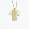 A gold rectangular pendant necklace with a polished finish, hanging from a delicate gold chain Part of our engravable range