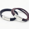 A black braided leather bracelet  and a brown braided lether bracelet with a polished silver rectangular  Stainless Steel  clasp. Part of the Engravable collection