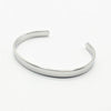 A minimalist polished silver cuff bracelet, Engravable. Made in Stainless Steel. Also avalible in Silver
