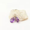 A pair of silver drop earrings with teardrop-shaped purple amethyst gemstones, Made with 925 SAterling Silver