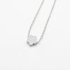 A minimalist high-polish stainless steel necklace featuring a dainty, solid cloud pendant on a delicate cable chain