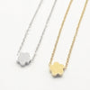 A minimalist high-polish stainless steel necklace featuring a dainty, solid cloud pendant on a delicate cable chain, 
