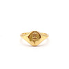 A gold signet ring with a Oval-shaped face engraved with a rose