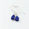 A pair of silver drop earrings with teardrop-shaped blue Lapis gemstones, Made with 925 Sterling Silver