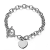 A silver chain bracelet with a toggle clasp and a dangling heart-shaped charm, shown on a plain white background.