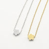 A minimalist high-polish stainless steel necklace featuring a dainty, solid cloud pendant on a delicate cable chain,.