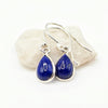 A pair of silver drop earrings with teardrop-shaped Blue Lapis gemstones, Made with 925 Sterling Silver