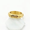 A gold vitnage style ring, with moon and sun and star engravings in it. made with stainless steel