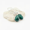 A pair of silver drop earrings with teardrop-shaped green malachite stones, Made of stering silver
