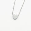A minimalist high-polish stainless steel necklace featuring a dainty, solid heart pendant on a delicate cable chain,Availble in gold and silver. Part of the engravable range