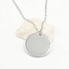 A minimalist high-polish stainless steel necklace featuring a blank 15mm round disk pendant